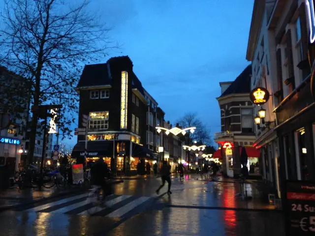 A city street and canal in the evening