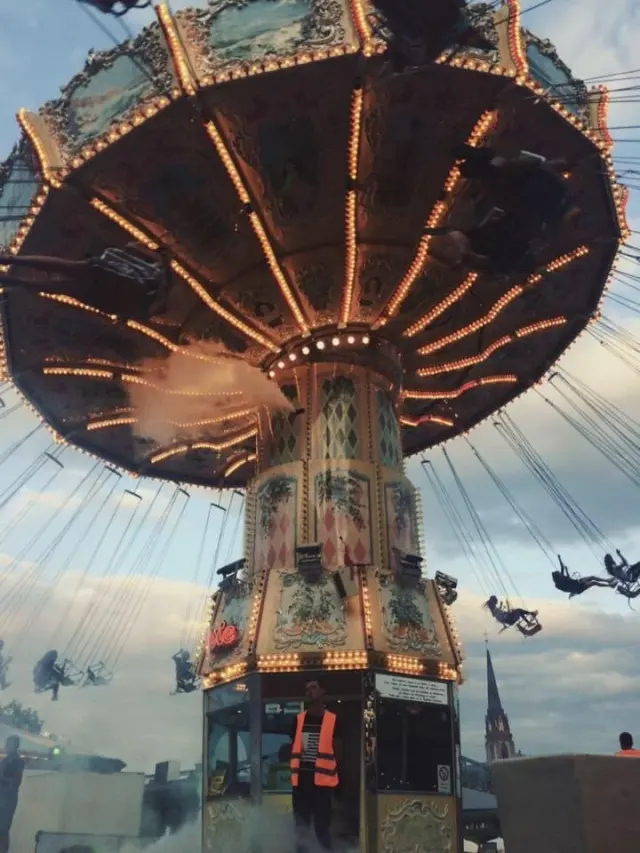 A swing carousel seen from below