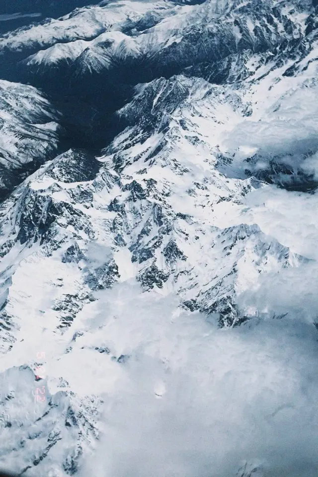 Snow-covered mountains seen from an airplane