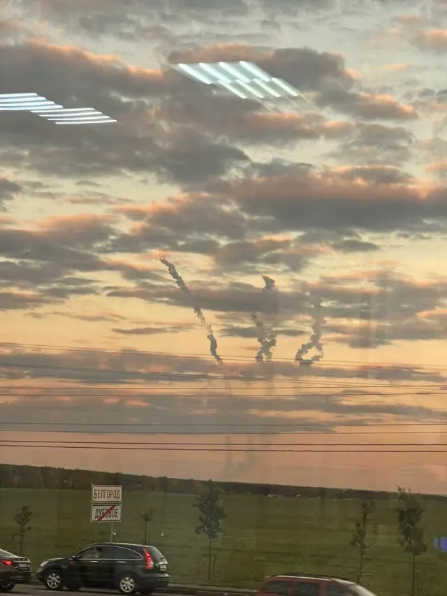 Sunset clouds seen through a window